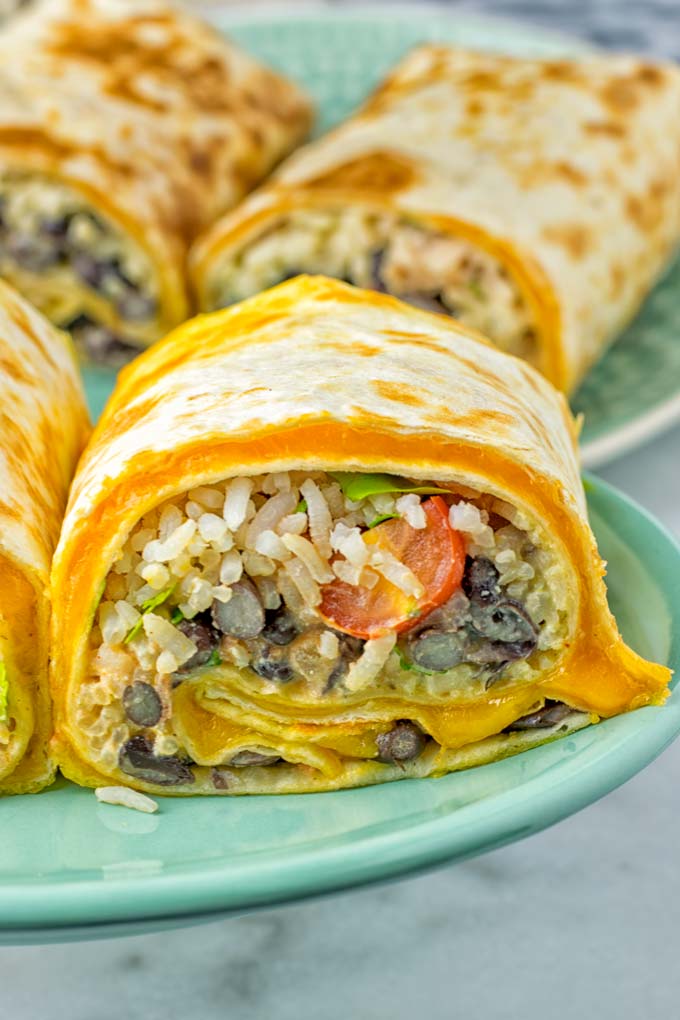 This Rice and Beans Quesarito is entirelly vegan, gluten free and so easy to make. It’s cheesy, incredibly satisfying and so delicious for dinner, lunch, meal prep (reheat beautifully) and amazing for work lunches. An amazing dairy free alternative for everyone that the whole family will love. #vegan #glutenfree #dairyfree #vegetarian #contentednesscooking #quesarito #riceandbeans #dinner #lunch #worklunchideas #mealprep #quesadila #burrito 