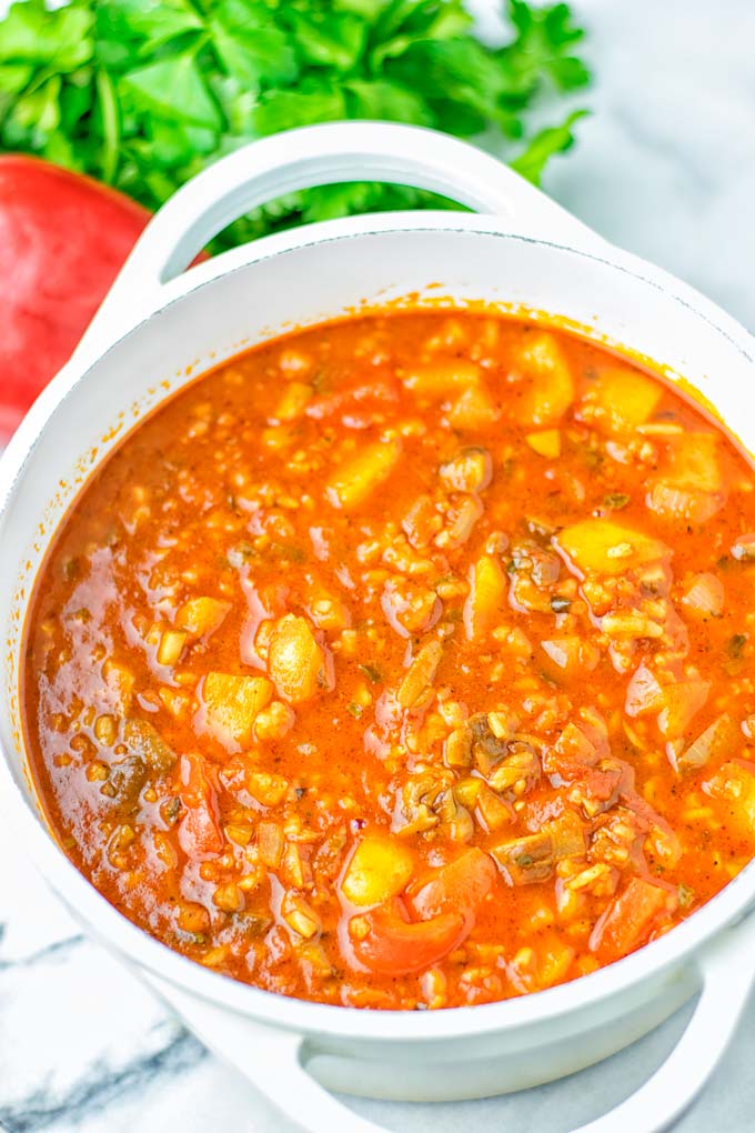 This Stuffed Pepper Soup is full of flavor with little preparation. In only 15 minutes, you have an easy and satisfying one pot meal which is naturally vegan, gluten free. Packed with mesmerizing flavors that the whole family will love for dinner, lunch, meal prep and so much more. Try it now and you will want this every day. #vegan #glutenfree #dairyfree #onepotmeals #vegetarian #mealprep #worklunchideas #stuffedpeppersoup #contentednesscooking #dinner #lunch 