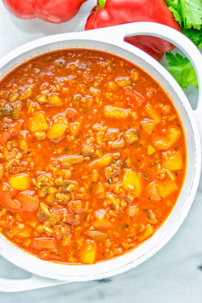 This Stuffed Pepper Soup is full of flavor with little preparation. In only 15 minutes, you have an easy and satisfying one pot meal which is naturally vegan, gluten free. Packed with mesmerizing flavors that the whole family will love for dinner, lunch, meal prep and so much more. Try it now and you will want this every day. #vegan #glutenfree #dairyfree #onepotmeals #vegetarian #mealprep #worklunchideas #stuffedpeppersoup #contentednesscooking #dinner #lunch 