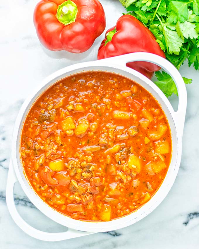 This Stuffed Pepper Soup is full of flavor with little preparation. In only 15 minutes, you have an easy and satisfying one pot meal which is naturally vegan, gluten free. Packed with mesmerizing flavors that the whole family will love for dinner, lunch, meal prep and so much more. Try it now and you will want this every day. #vegan #glutenfree #dairyfree #onepotmeals #vegetarian #mealprep #worklunchideas #stuffedpeppersoup #contentednesscooking #dinner #lunch 