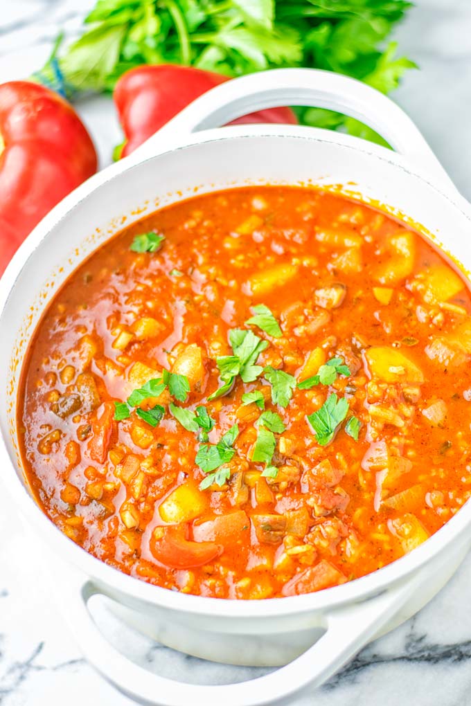 This Stuffed Pepper Soup is full of flavor with little preparation. In only 15 minutes, you have an easy and satisfying one pot meal which is naturally vegan, gluten free. Packed with mesmerizing flavors that the whole family will love for dinner, lunch, meal prep and so much more. Try it now and you will want this every day. #vegan #glutenfree #dairyfree #onepotmeals #vegetarian #mealprep #worklunchideas #stuffedpeppersoup #contentednesscooking #dinner #lunch 