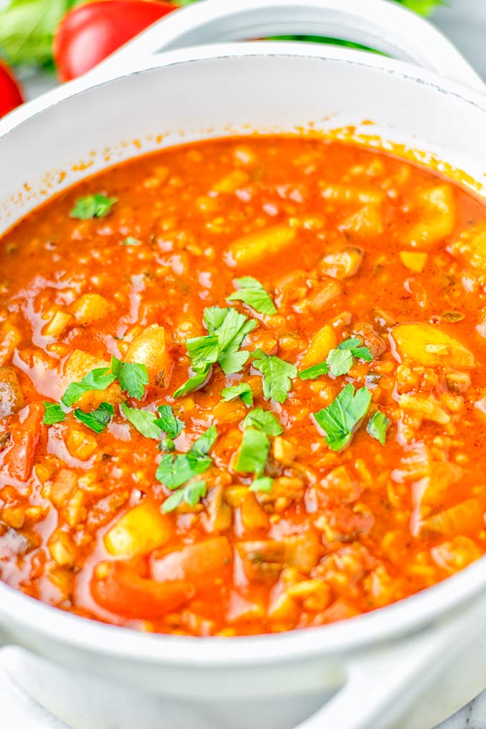 This Stuffed Pepper Soup is full of flavor with little preparation. In only 15 minutes, you have an easy and satisfying one pot meal which is naturally vegan, gluten free. Packed with mesmerizing flavors that the whole family will love for dinner, lunch, meal prep and so much more. Try it now and you will want this every day. #vegan #glutenfree #dairyfree #onepotmeals #vegetarian #mealprep #worklunchideas #stuffedpeppersoup #contentednesscooking #dinner #lunch 