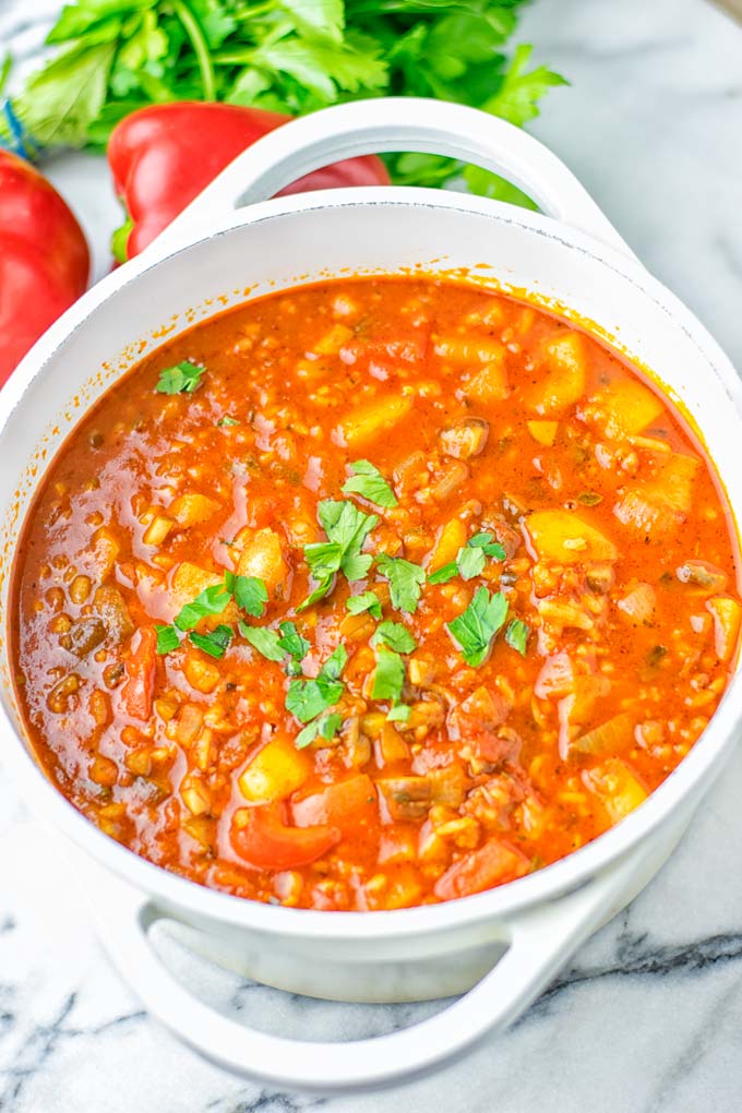 This Stuffed Pepper Soup is full of flavor with little preparation. In only 15 minutes, you have an easy and satisfying one pot meal which is naturally vegan, gluten free. Packed with mesmerizing flavors that the whole family will love for dinner, lunch, meal prep and so much more. Try it now and you will want this every day. #vegan #glutenfree #dairyfree #onepotmeals #vegetarian #mealprep #worklunchideas #stuffedpeppersoup #contentednesscooking #dinner #lunch 