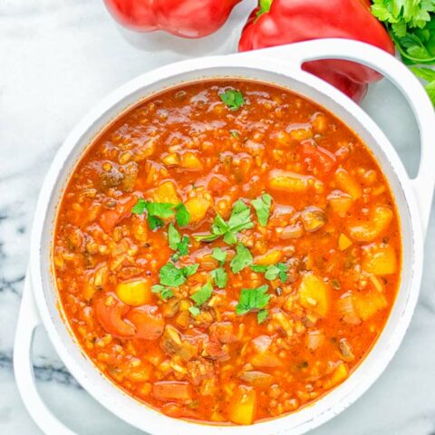 This Stuffed Pepper Soup is full of flavor with little preparation. In only 15 minutes, you have an easy and satisfying one pot meal which is naturally vegan, gluten free. Packed with mesmerizing flavors that the whole family will love for dinner, lunch, meal prep and so much more. Try it now and you will want this every day. #vegan #glutenfree #dairyfree #onepotmeals #vegetarian #mealprep #worklunchideas #stuffedpeppersoup #contentednesscooking #dinner #lunch