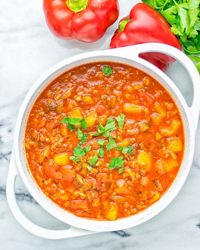 This Stuffed Pepper Soup is full of flavor with little preparation. In only 15 minutes, you have an easy and satisfying one pot meal which is naturally vegan, gluten free. Packed with mesmerizing flavors that the whole family will love for dinner, lunch, meal prep and so much more. Try it now and you will want this every day. #vegan #glutenfree #dairyfree #onepotmeals #vegetarian #mealprep #worklunchideas #stuffedpeppersoup #contentednesscooking #dinner #lunch 