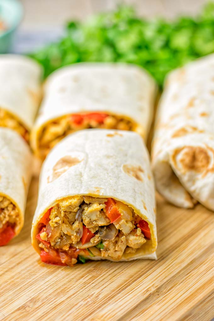 This Vegan Breakfast Burrito with Tofu Scramble is super easy to make and seriously the best burritos you’ve ever made and tasted. No one would guess it’s entirely vegan, gluten free and your family won’t miss the cheese or meat in these. These are also an amazing pick for meal prep, dinner, lunch, work lunch and so much more. #vegan #dairyfree #glutenfree #contentednesscooking #breakfastburritos #tofuscramble #breakfastideas #budgetmeals #dinner #lunch #mealprep #worklunchideas 