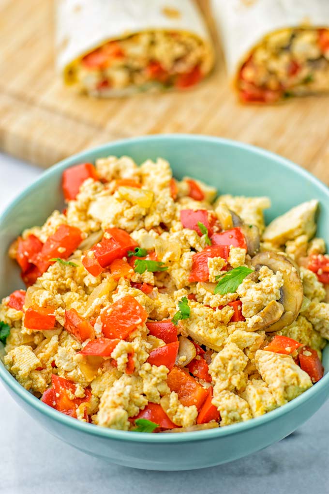 This Vegan Breakfast Burrito with Tofu Scramble is super easy to make and seriously the best burritos you’ve ever made and tasted. No one would guess it’s entirely vegan, gluten free and your family won’t miss the cheese or meat in these. These are also an amazing pick for meal prep, dinner, lunch, work lunch and so much more. #vegan #dairyfree #glutenfree #contentednesscooking #breakfastburritos #tofuscramble #breakfastideas #budgetmeals #dinner #lunch #mealprep #worklunchideas 