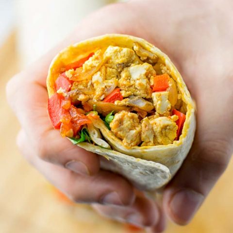 This Vegan Breakfast Burrito with Tofu Scramble is super easy to make and seriously the best burritos you’ve ever made and tasted. No one would guess it’s entirely vegan, gluten free and your family won’t miss the cheese or meat in these. These are also an amazing pick for meal prep, dinner, lunch, work lunch and so much more. #vegan #dairyfree #glutenfree #contentednesscooking #breakfastburritos #tofuscramble #breakfastideas #budgetmeals #dinner #lunch #mealprep #worklunchideas