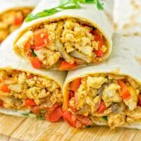 This Vegan Breakfast Burrito with Tofu Scramble is super easy to make and seriously the best burritos you’ve ever made and tasted. No one would guess it’s entirely vegan, gluten free and your family won’t miss the cheese or meat in these. These are also an amazing pick for meal prep, dinner, lunch, work lunch and so much more. #vegan #dairyfree #glutenfree #contentednesscooking #breakfastburritos #tofuscramble #breakfastideas #budgetmeals #dinner #lunch #mealprep #worklunchideas