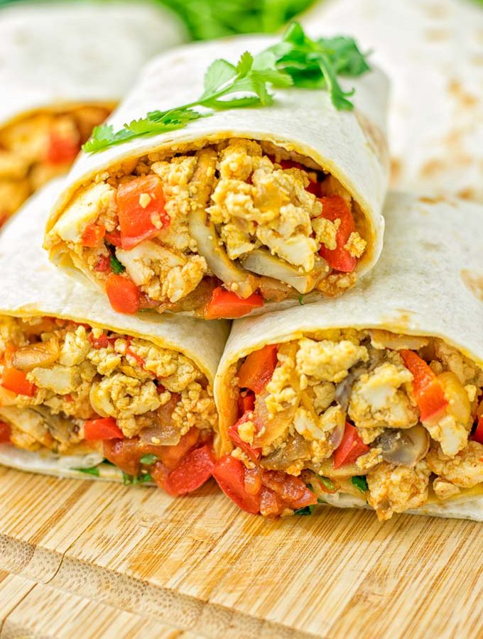 This Vegan Breakfast Burrito with Tofu Scramble is super easy to make and seriously the best burritos you’ve ever made and tasted. No one would guess it’s entirely vegan, gluten free and your family won’t miss the cheese or meat in these. These are also an amazing pick for meal prep, dinner, lunch, work lunch and so much more. #vegan #dairyfree #glutenfree #contentednesscooking #breakfastburritos #tofuscramble #breakfastideas #budgetmeals #dinner #lunch #mealprep #worklunchideas