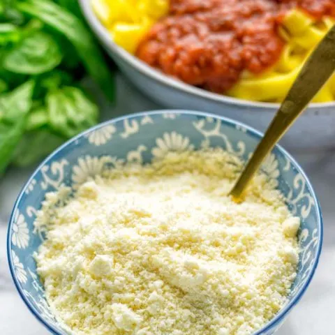 This Vegan Parmesan Cheese is made with super simple 3 ingredients in 1 minute. Trust me you really want this recipe - so versatile for all your pasta, casseroles, salads and so much more. It’s a keeper for lunch, dinner, meal prep, work lunch that the whole family will love. #vegan #dairyfree #glutenfree #dinner #lunch #mealprep #worklunchideas #contentednesscooking #veganparmesancheese #pasta #pizza #casseroles #salads #familyfoodideas