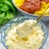 This Vegan Parmesan Cheese is made with super simple 3 ingredients in 1 minute. Trust me you really want this recipe - so versatile for all your pasta, casseroles, salads and so much more. It’s a keeper for lunch, dinner, meal prep, work lunch that the whole family will love. #vegan #dairyfree #glutenfree #dinner #lunch #mealprep #worklunchideas #contentednesscooking #veganparmesancheese #pasta #pizza #casseroles #salads #familyfoodideas