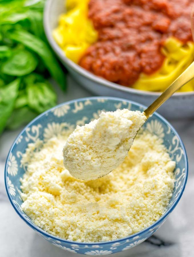 This Vegan Parmesan Cheese is made with super simple 3 ingredients in 1 minute. Trust me you really want this recipe - so versatile for all your pasta, casseroles, salads and so much more. It’s a keeper for lunch, dinner, meal prep, work lunch that the whole family will love. #vegan #dairyfree #glutenfree #dinner #lunch #mealprep #worklunchideas #contentednesscooking #veganparmesancheese #pasta #pizza #casseroles #salads #familyfoodideas