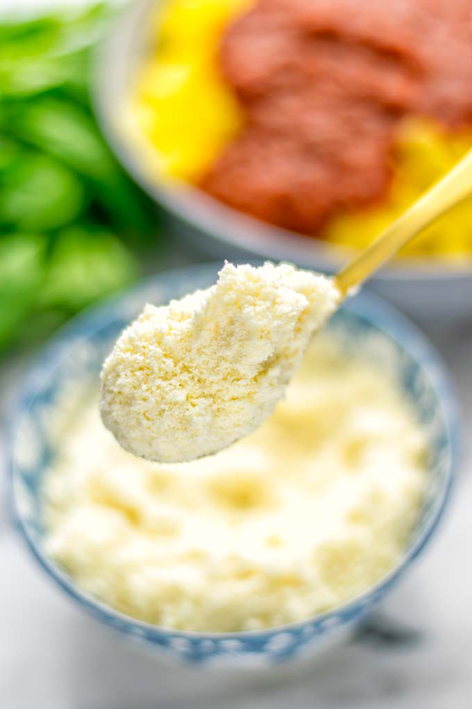 This Vegan Parmesan Cheese is made with super simple 3 ingredients in 1 minute. Trust me you really want this recipe - so versatile for all your pasta, casseroles, salads and so much more. It’s a keeper for lunch, dinner, meal prep, work lunch that the whole family will love. #vegan #dairyfree #glutenfree #dinner #lunch #mealprep #worklunchideas #contentednesscooking #veganparmesancheese #pasta #pizza #casseroles #salads #familyfoodideas