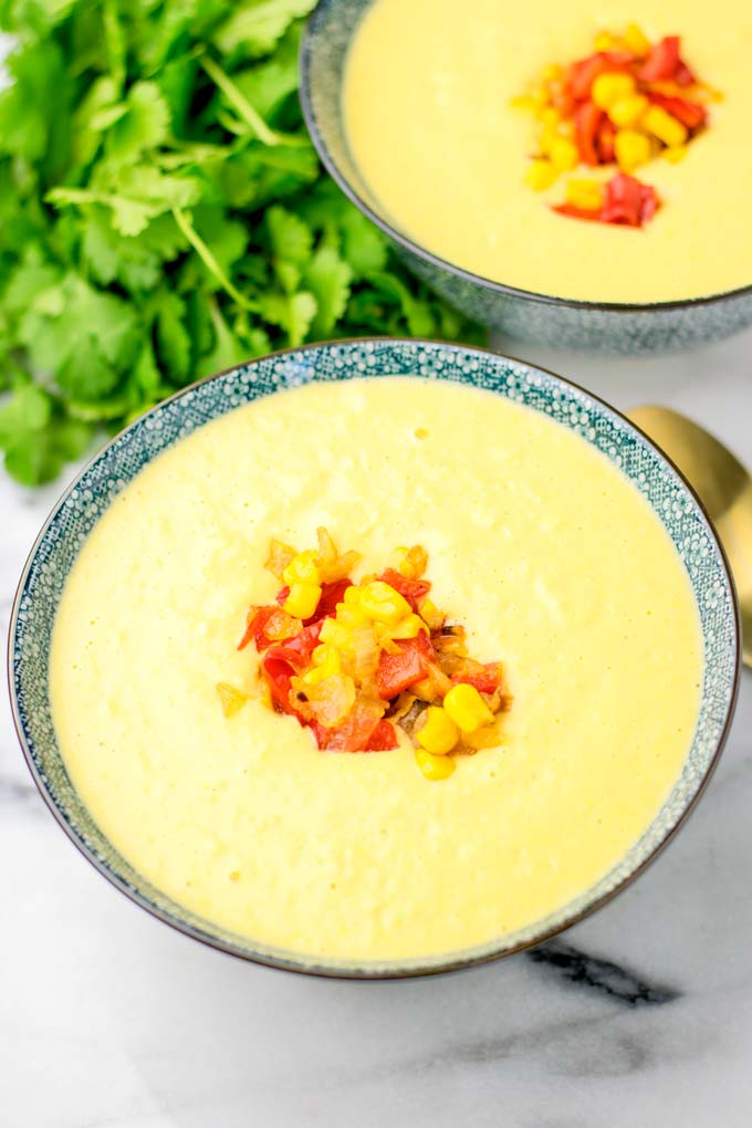 Two bowls of Instant Pot Corn Chowder with cilantro.