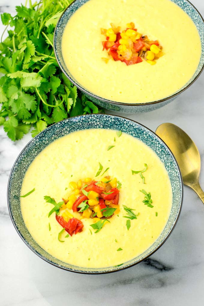 Full bowl of Instant Pot Corn Chowder, decorated with Cilantro.
