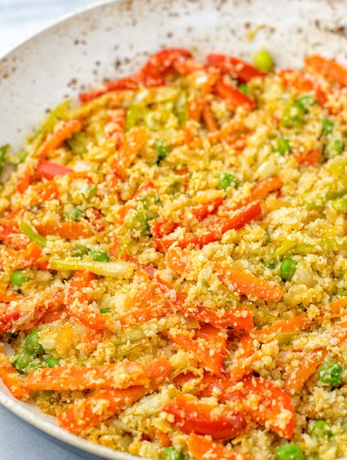 Cauliflower Fried Rice as it is being made in a pan.