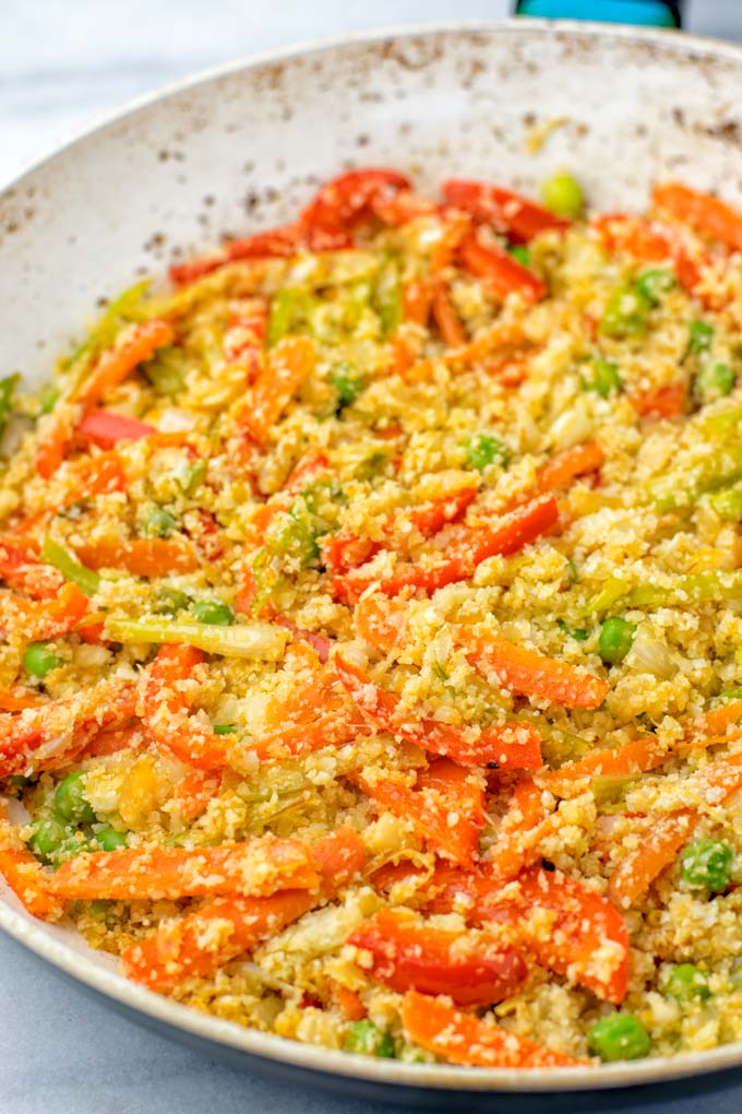 Cauliflower Fried Rice as it is being made in a pan.