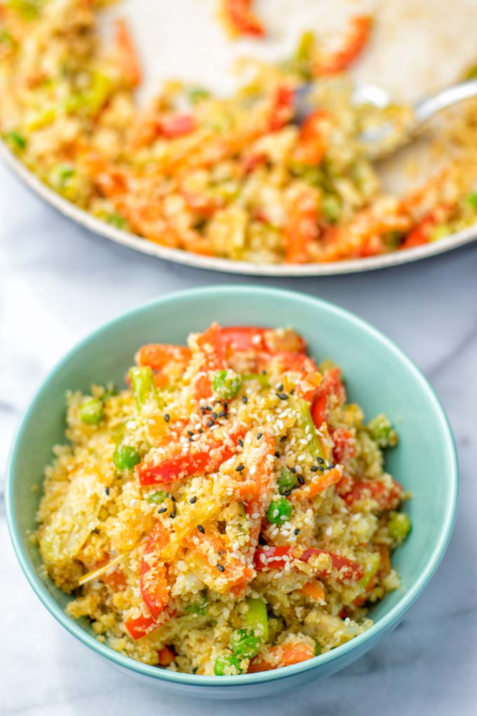 Pan and small bowl of prepared fried rice.