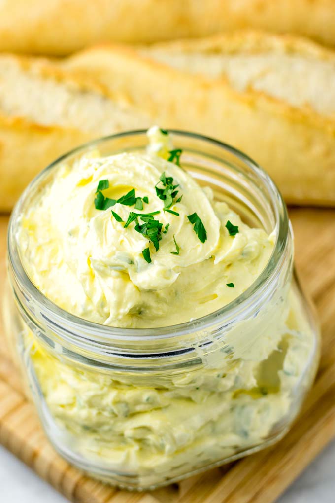Large jar of Garlic Butter, decorated with parsley.