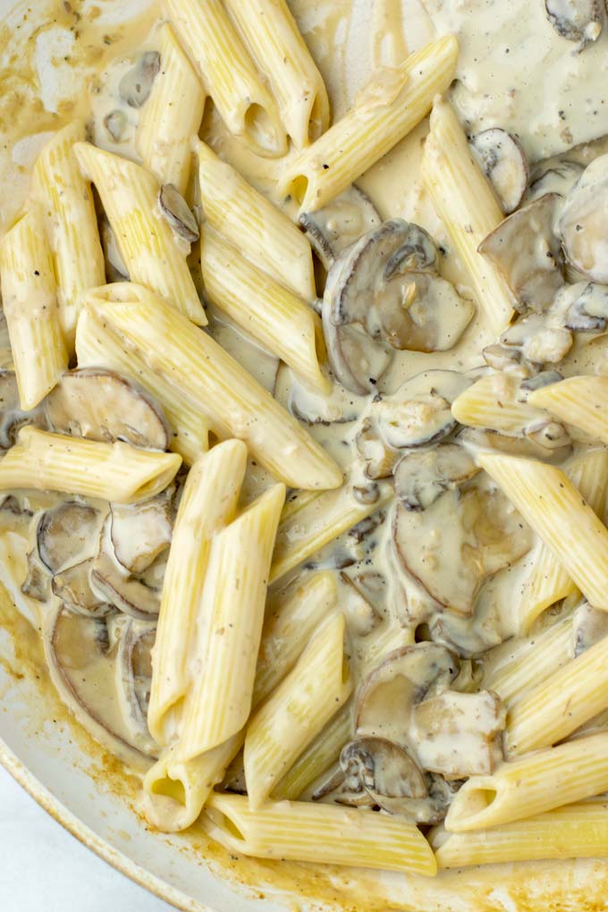 Closeup of the vegan Marsala sauce mixed with pasta.