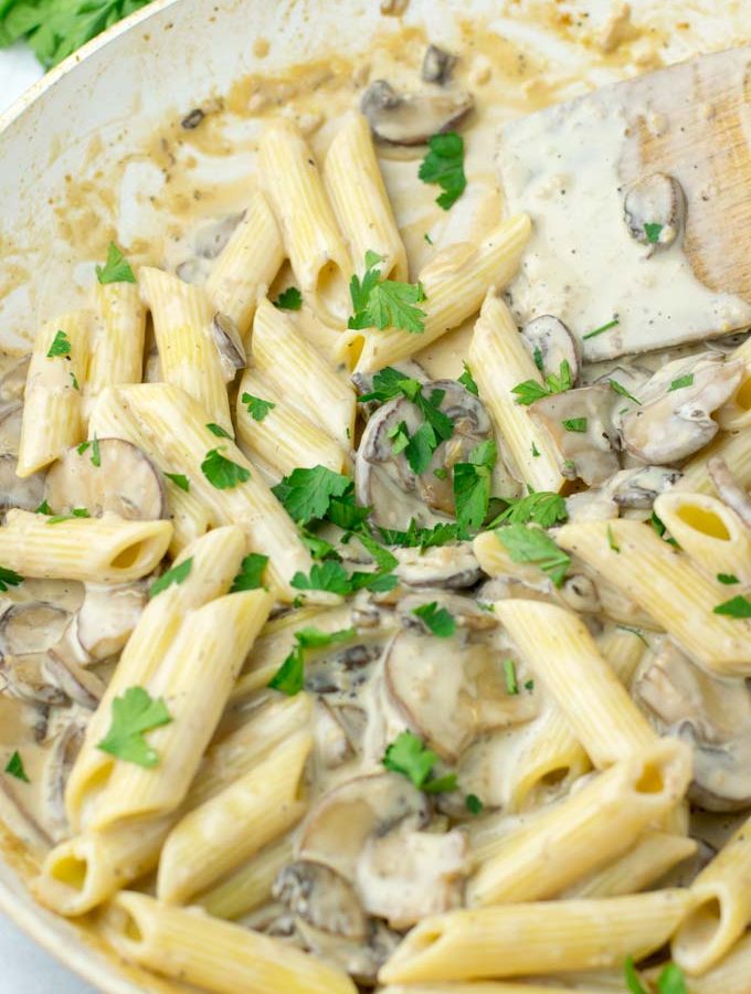 Marsala sauce over pasta, sprinkled with parsley.
