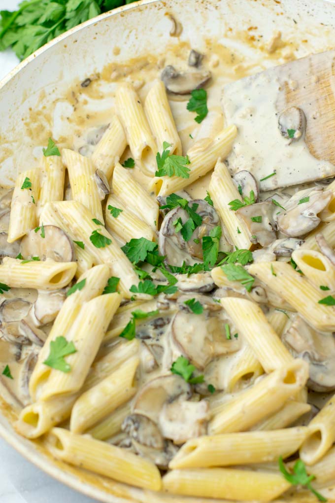 Marsala sauce over pasta, sprinkled with parsley.