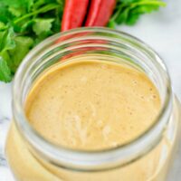 Closeup of Satay Sauce in a jar.