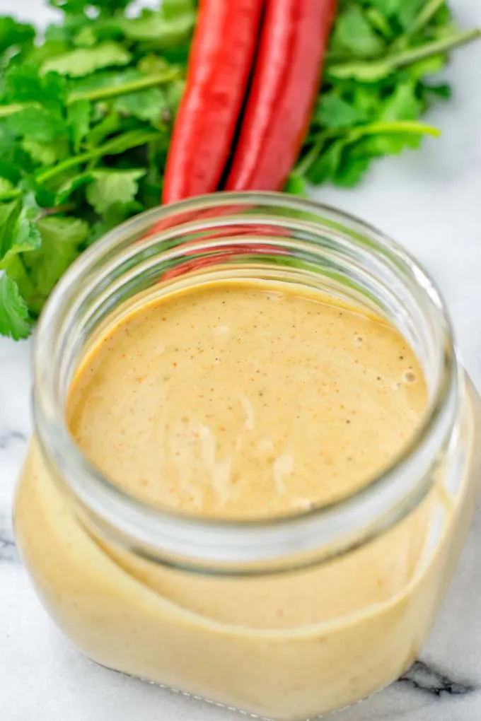 Closeup of Satay Sauce in a jar.