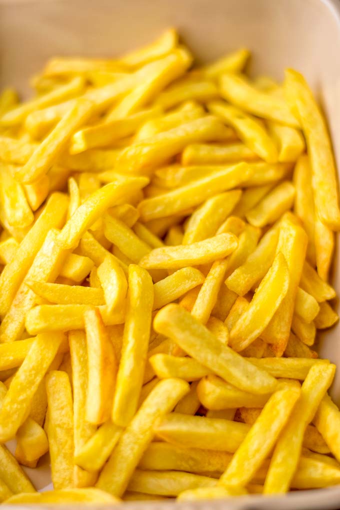 A full bowl of oven fries.