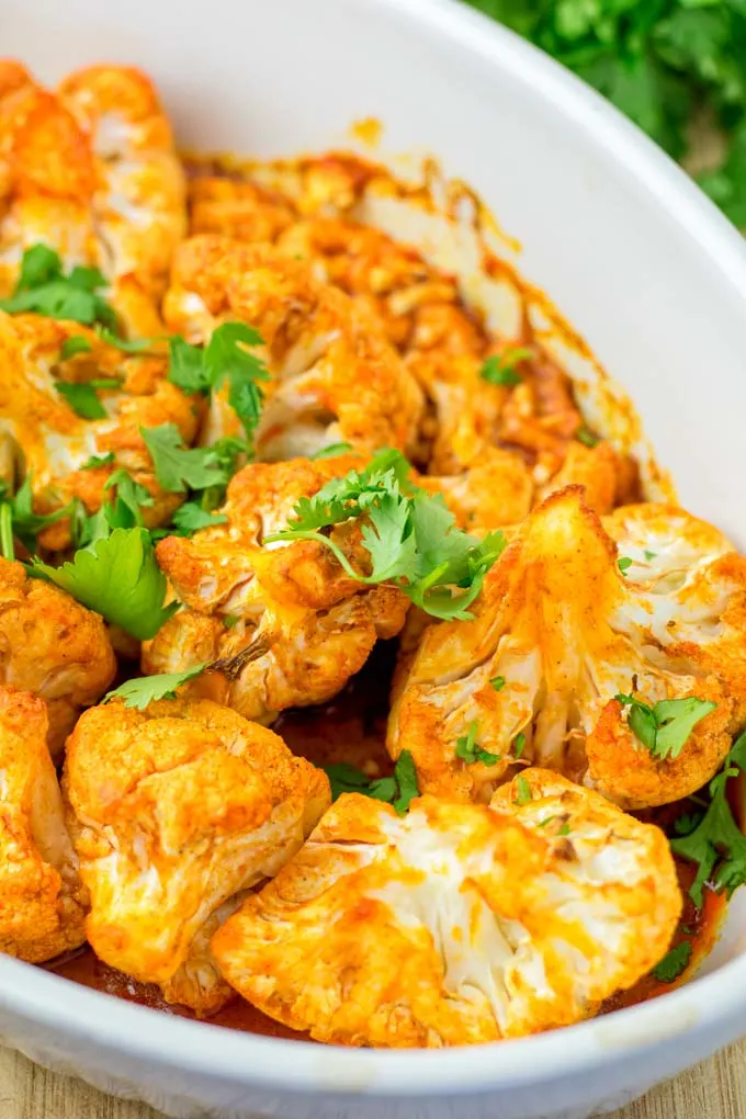 BUffalo Cauliflower decorated with cilantro.