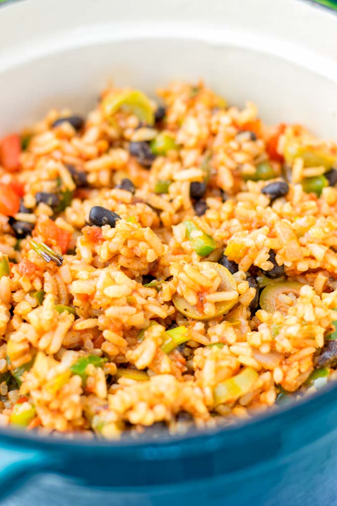 Close up view of rice and vegetable mix in a large pot.