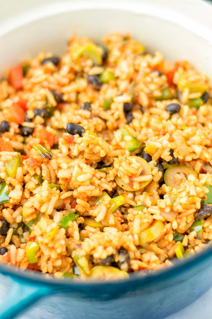 Zoom into the pot, showing the red rice and vegetables.