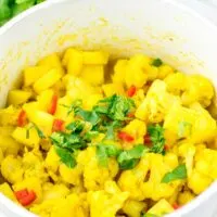Family portion of Aloo Gobi is sprinkled with cilantro.