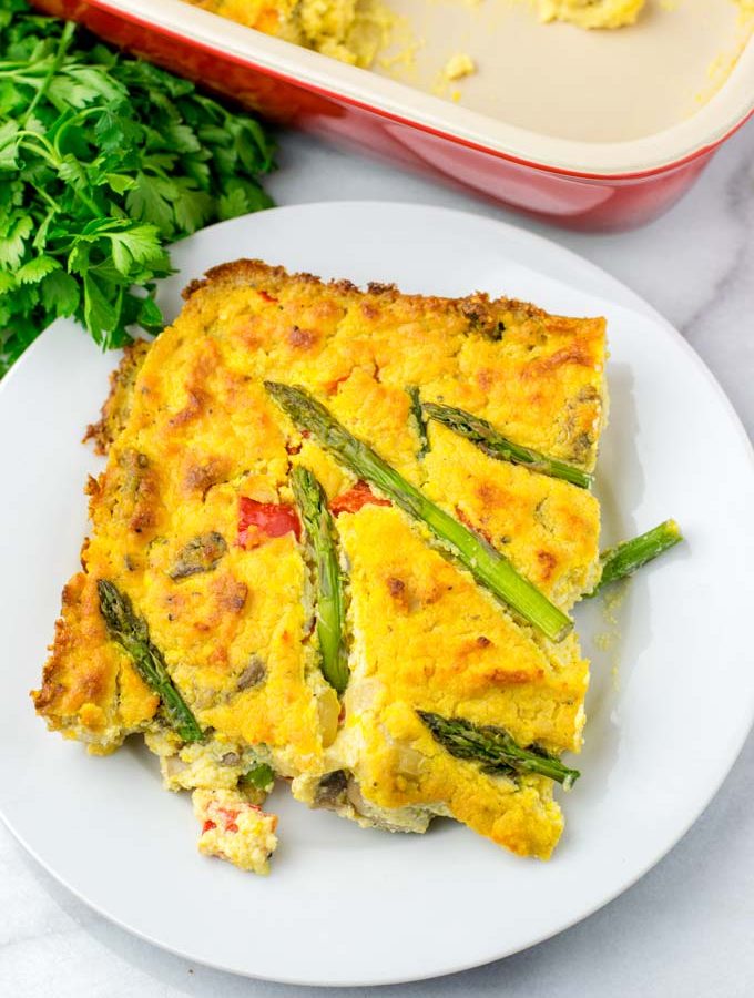 Portion of the Asparagus Quiche on a white plate.