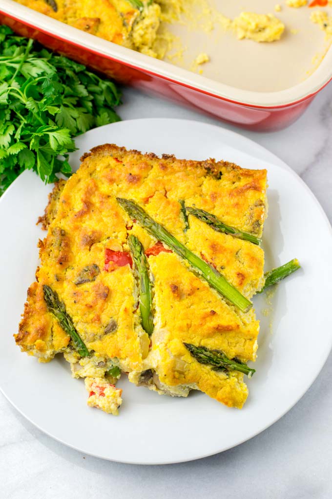 Portion of the Asparagus Quiche on a white plate.