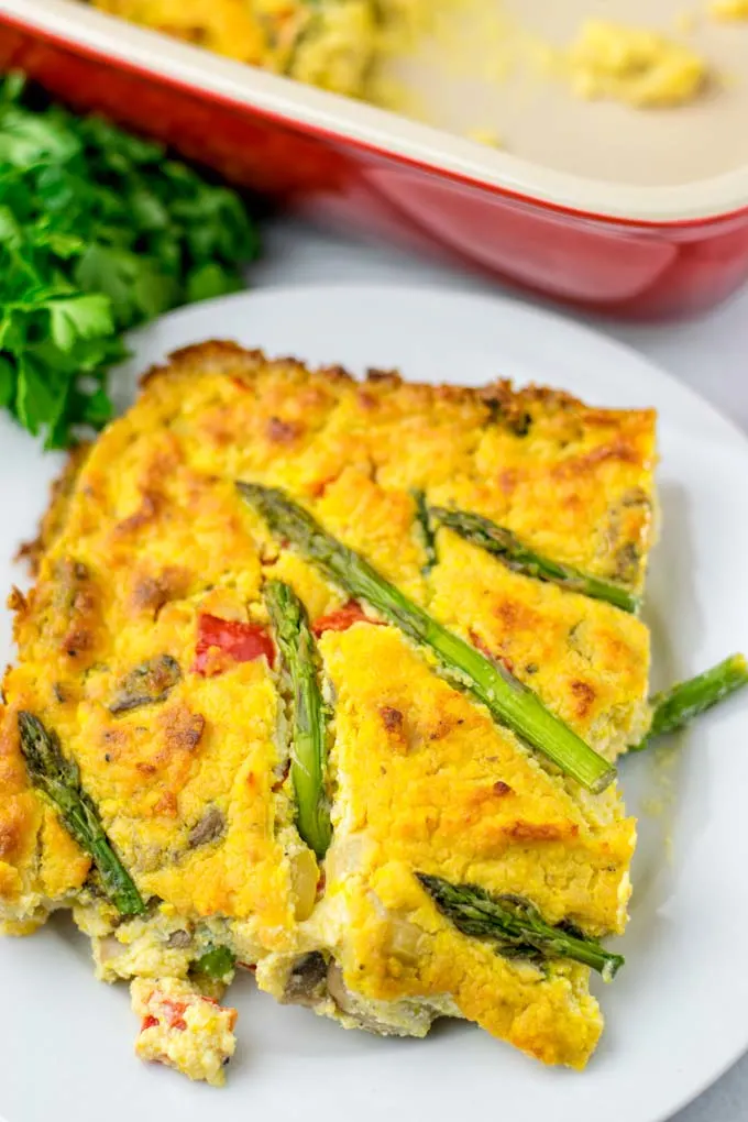 Closeup view showing the golden brown baked tofu filling, bell pepper, asparagus tips, and mushrooms.