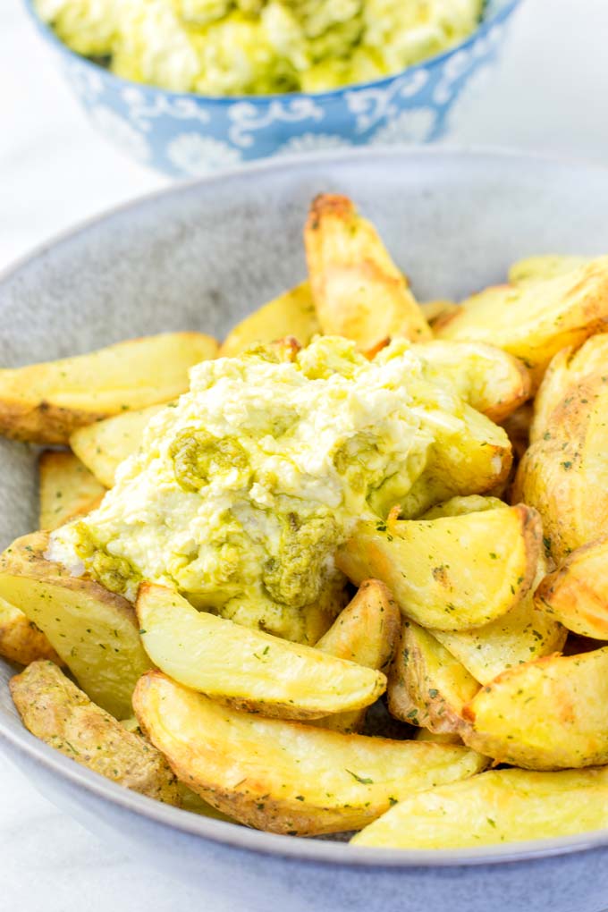 Melting butter over potato fries.