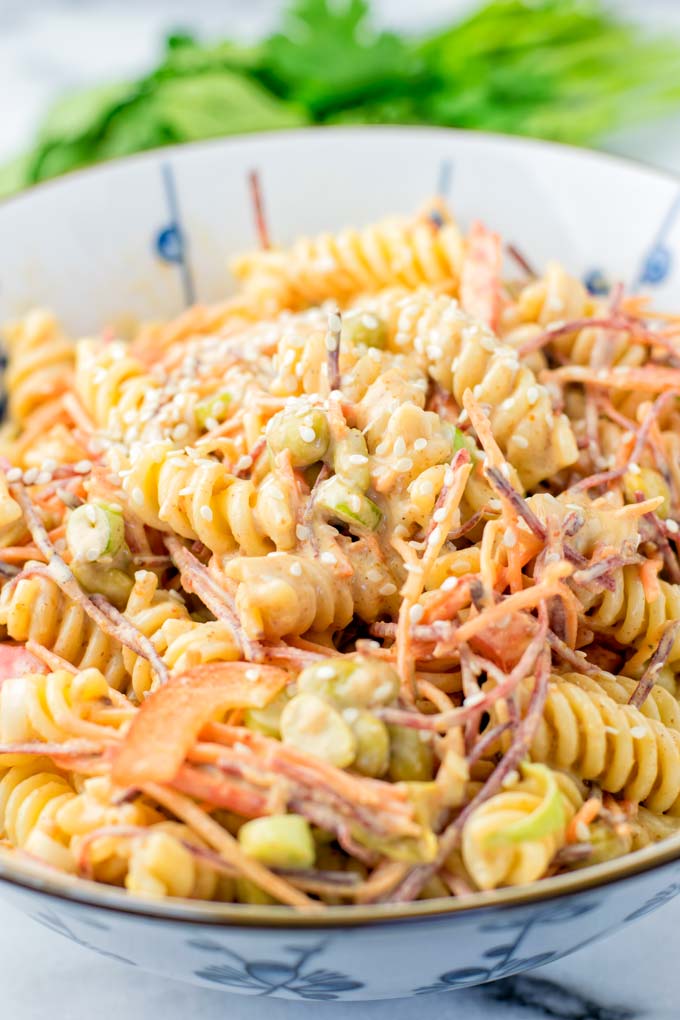 Fresh vegetables in this vegan salad include shredded carrots and edamame.