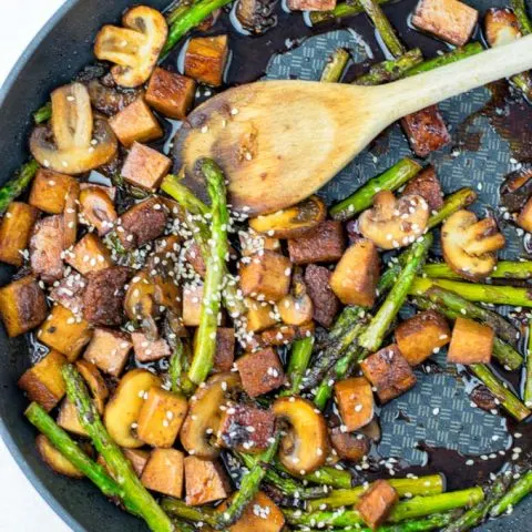 Finishing touches to the cooked dish.