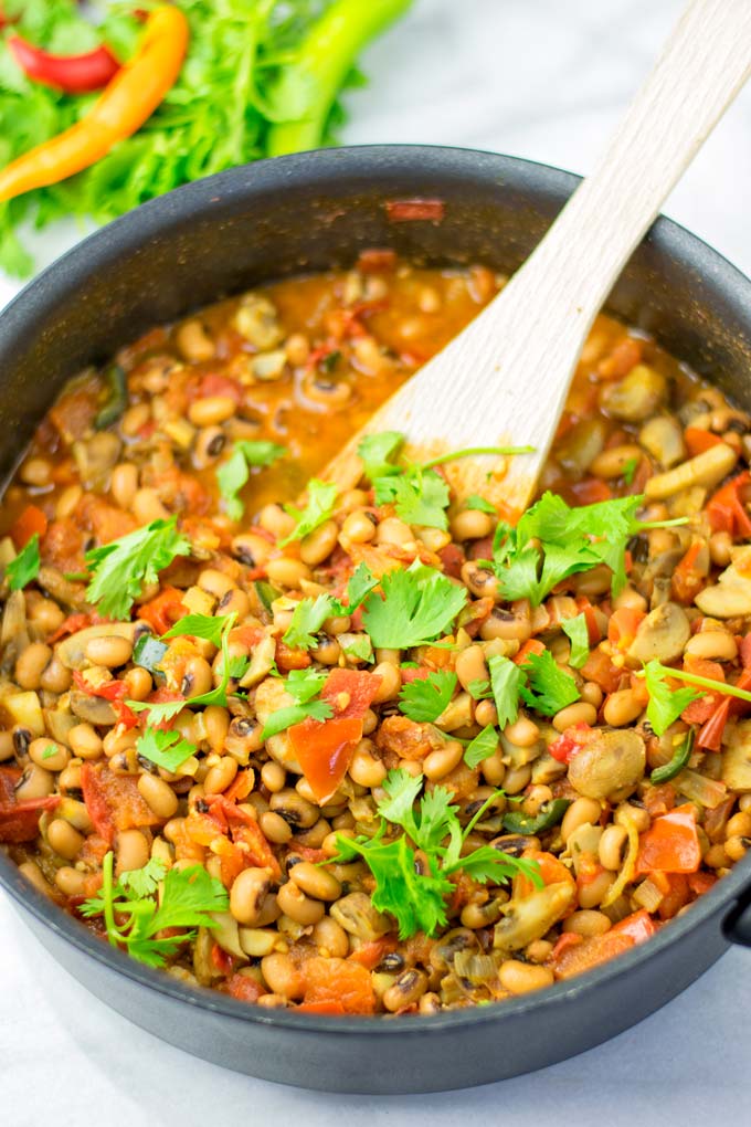 Full pan of mixed beans decorated with cilantro. Vegan and Vegetarian version.