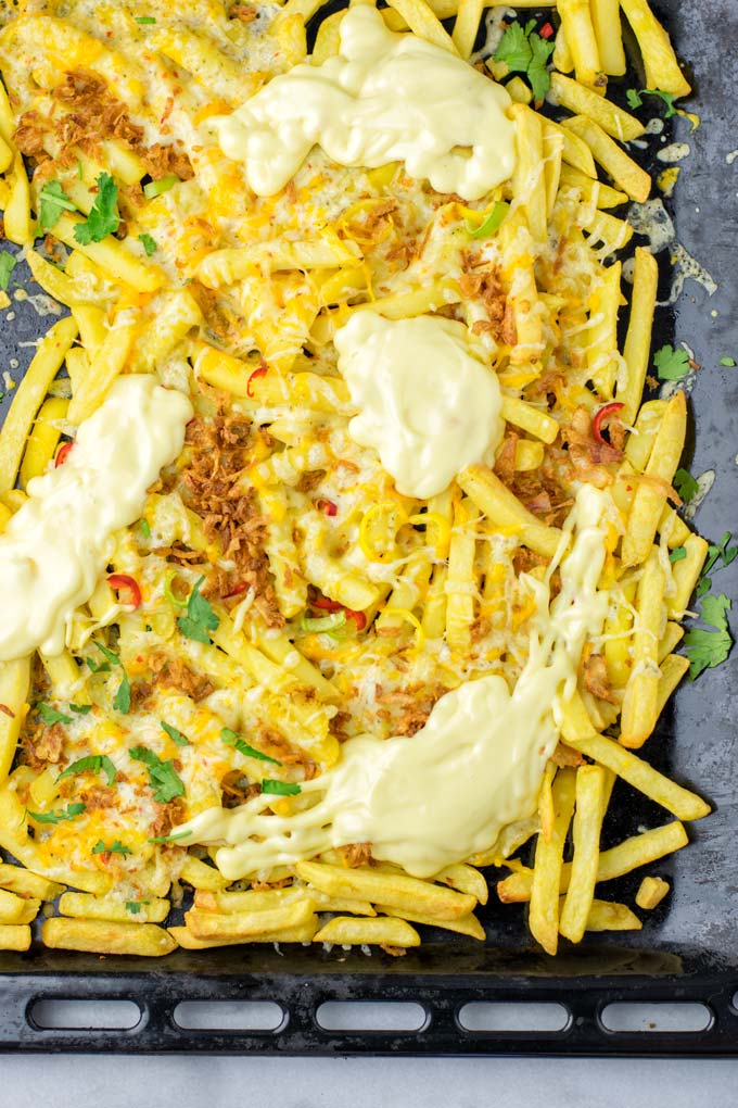 Top view of the Animal Style Fries after baking in to oven.