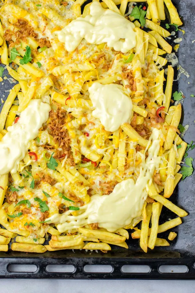 Top view of the Animal Style Fries after baking in to oven.