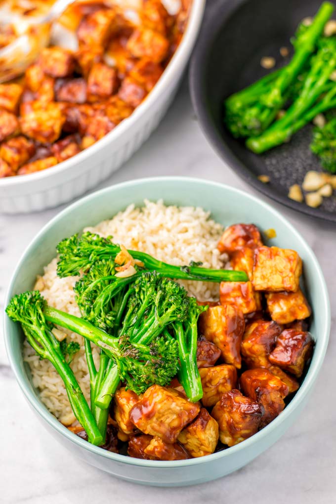 Large bowl with rice, tempeh marianted in BBQ sauce, and pan roasted broccoli.