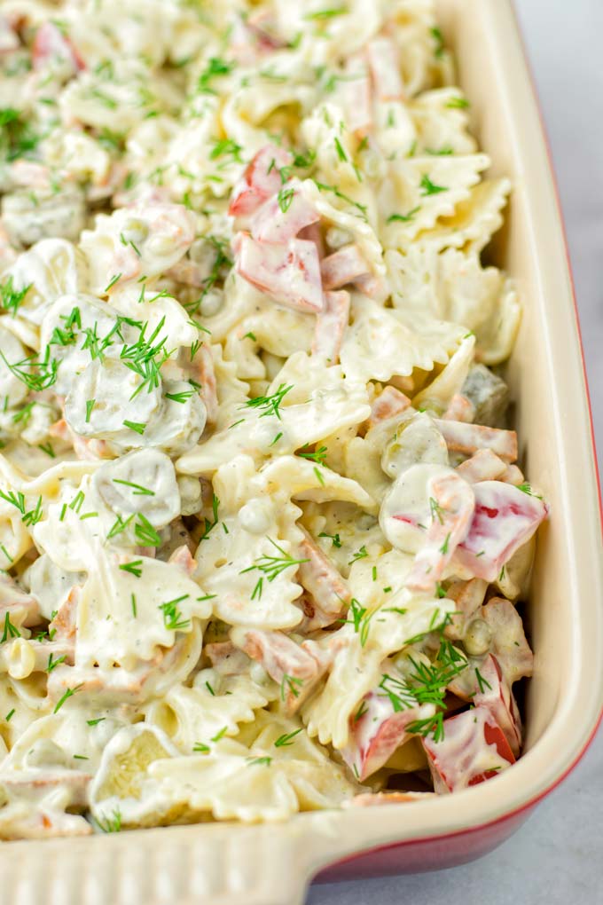 Cook Bow Tie (farfalle) pasta and let it cool down as the first step in making this mayo-free salad.