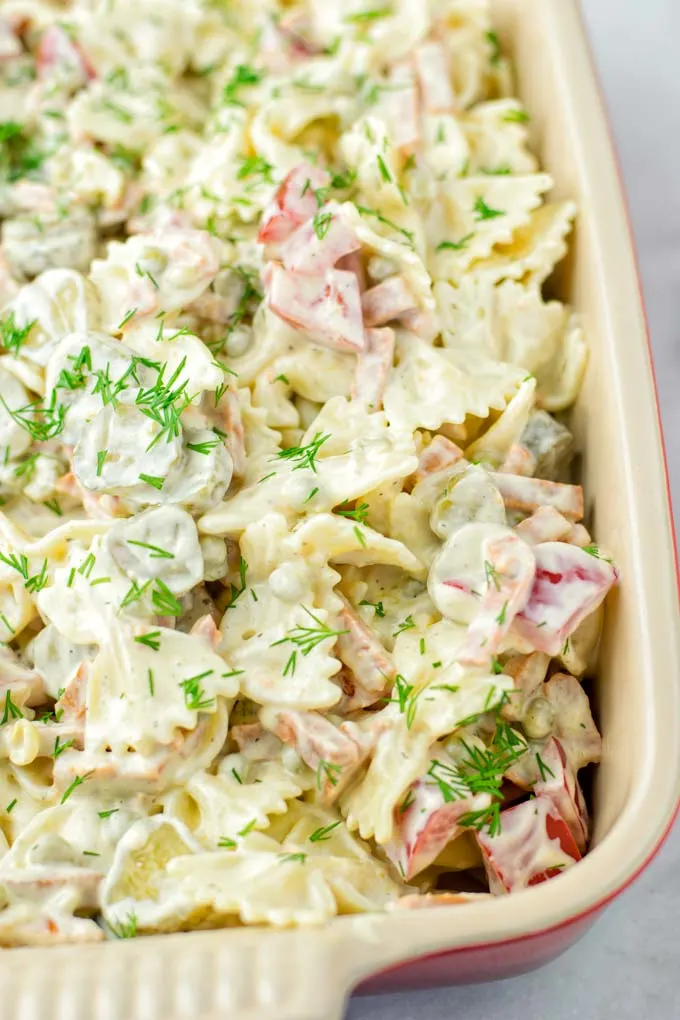 Cook Bow Tie (farfalle) pasta and let it cool down as the first step in making this mayo-free salad.