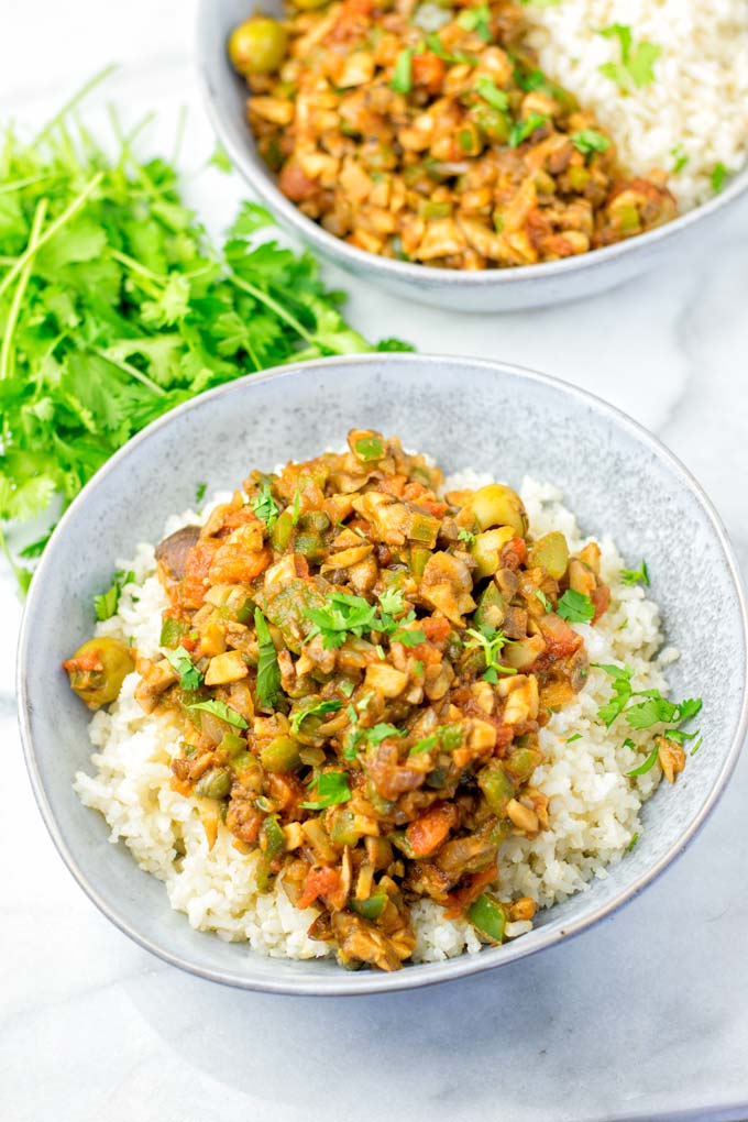 Cuban Picadillo served in a bowl over rice.