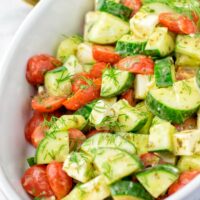 Chop your favorite tomatoes and ca cucumber in not too small pieces.