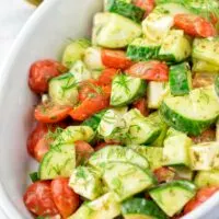 Chop your favorite tomatoes and ca cucumber in not too small pieces.