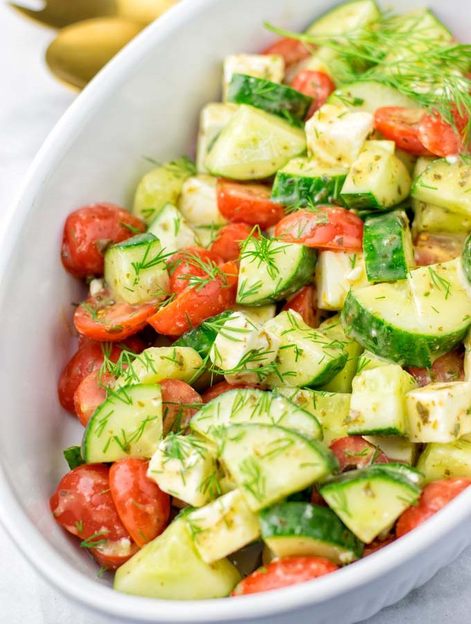 Chop your favorite tomatoes and ca cucumber in not too small pieces.